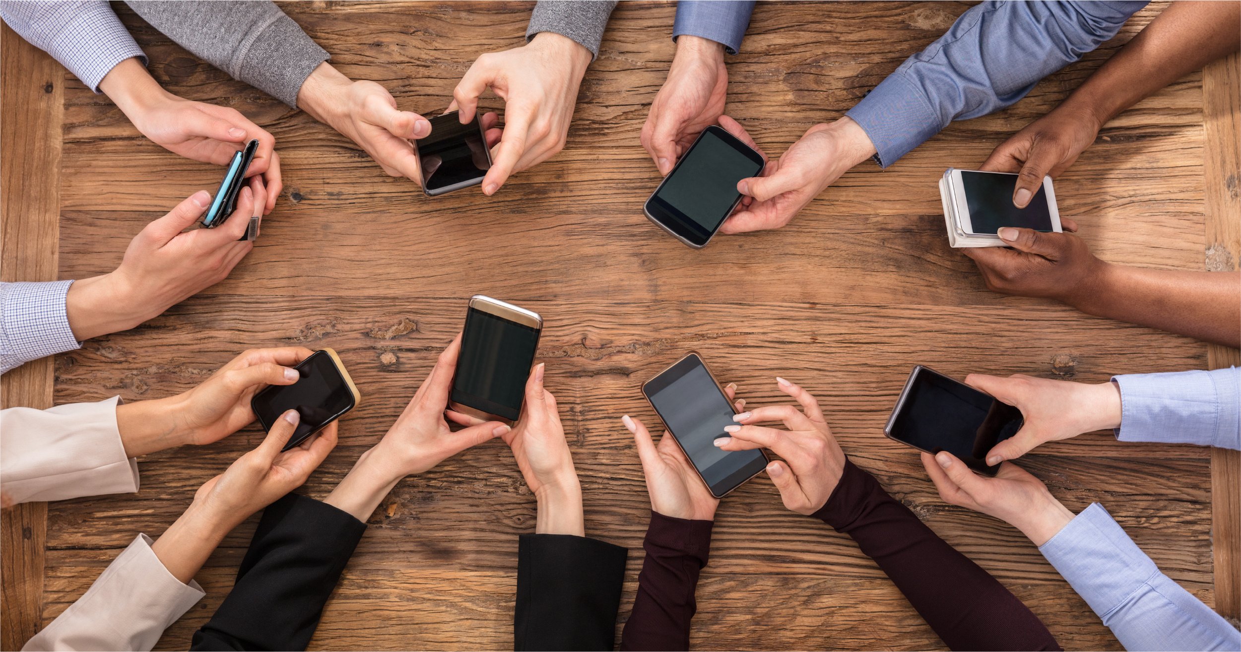 Business people using their own phones. 