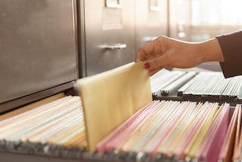 an image of adding a folder to a filing cabinet