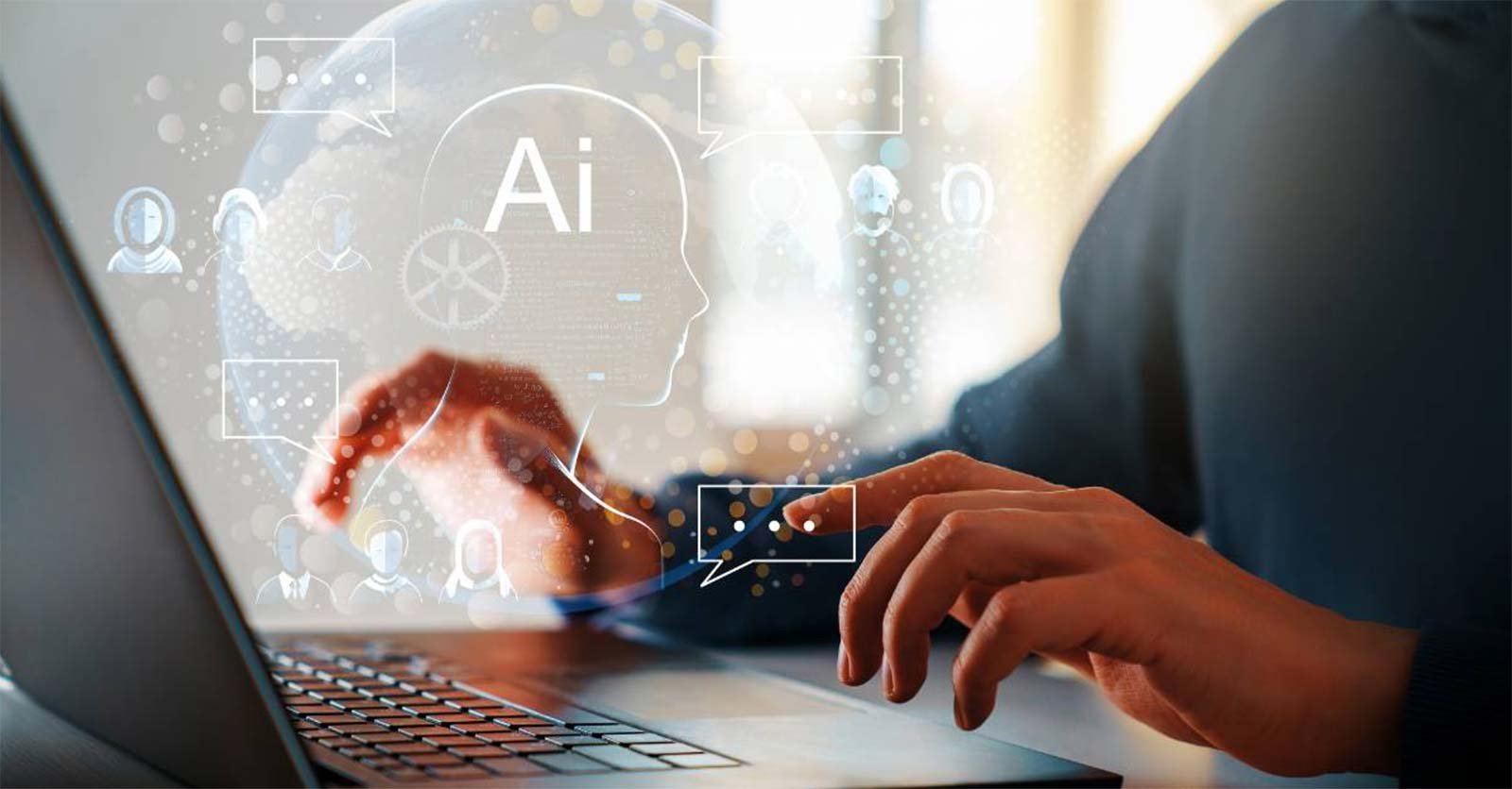 A male employee's hands hover over a laptop keyboard with a digitized depiction of AI and automation tools.