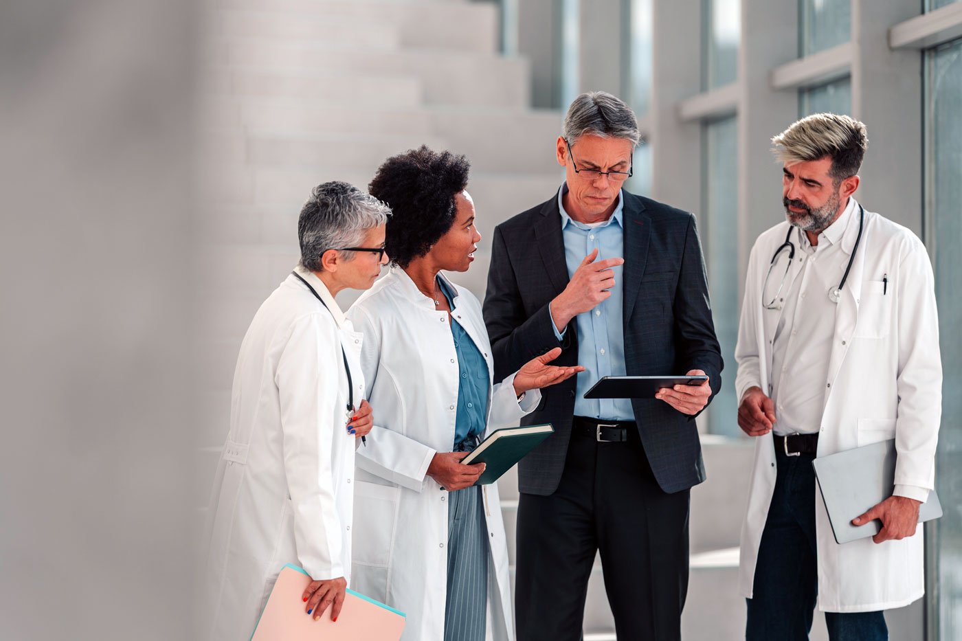 tech-expert-talking-to-group-of-doctors