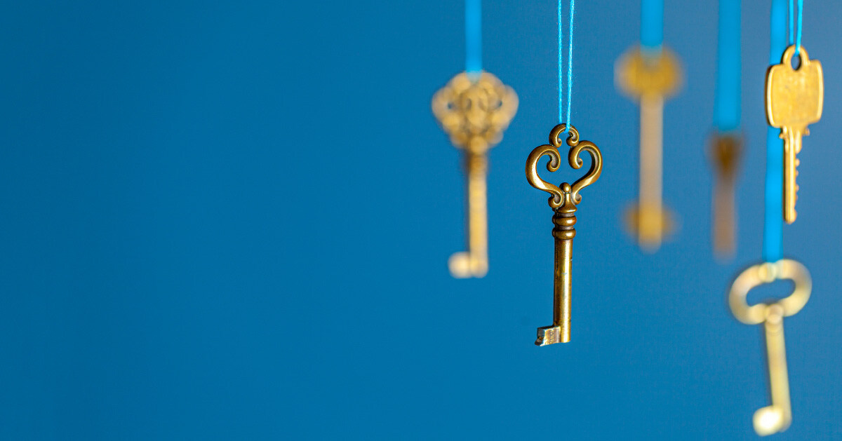 Uniqiue keys dangle by a thread, representing how careless many employees are with their login credentials.